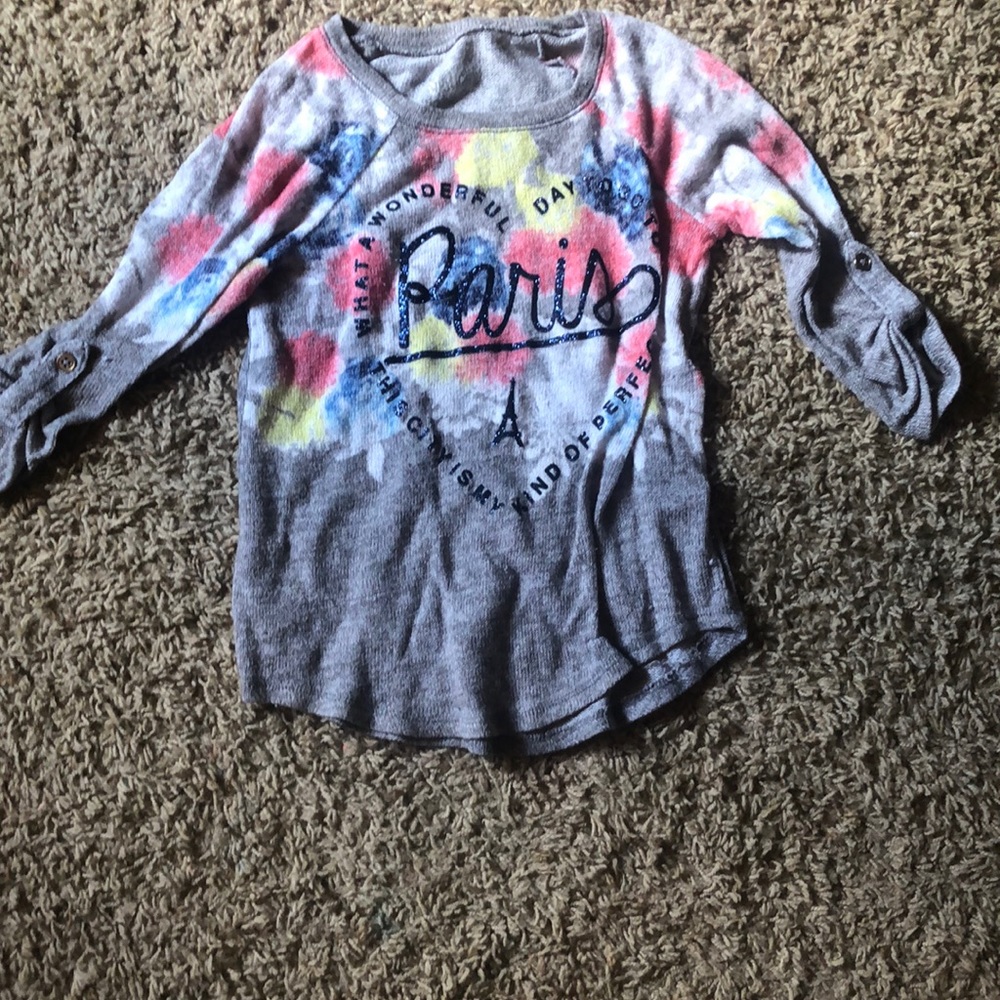 A half sleeve shirt with a lot of colors on it